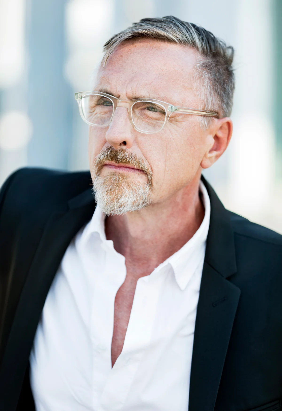 Handsome and wealthy independent gentleman in his early 60s portrait outside in the city