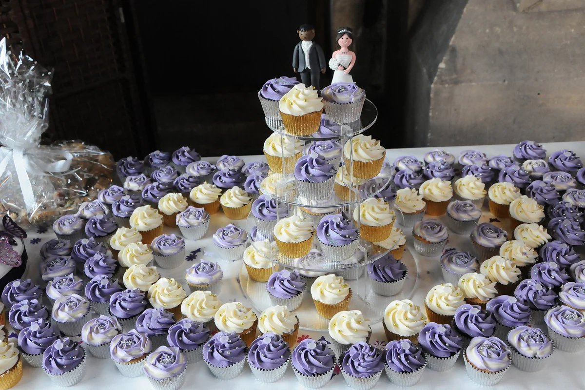Purple and white wedding cupcake display