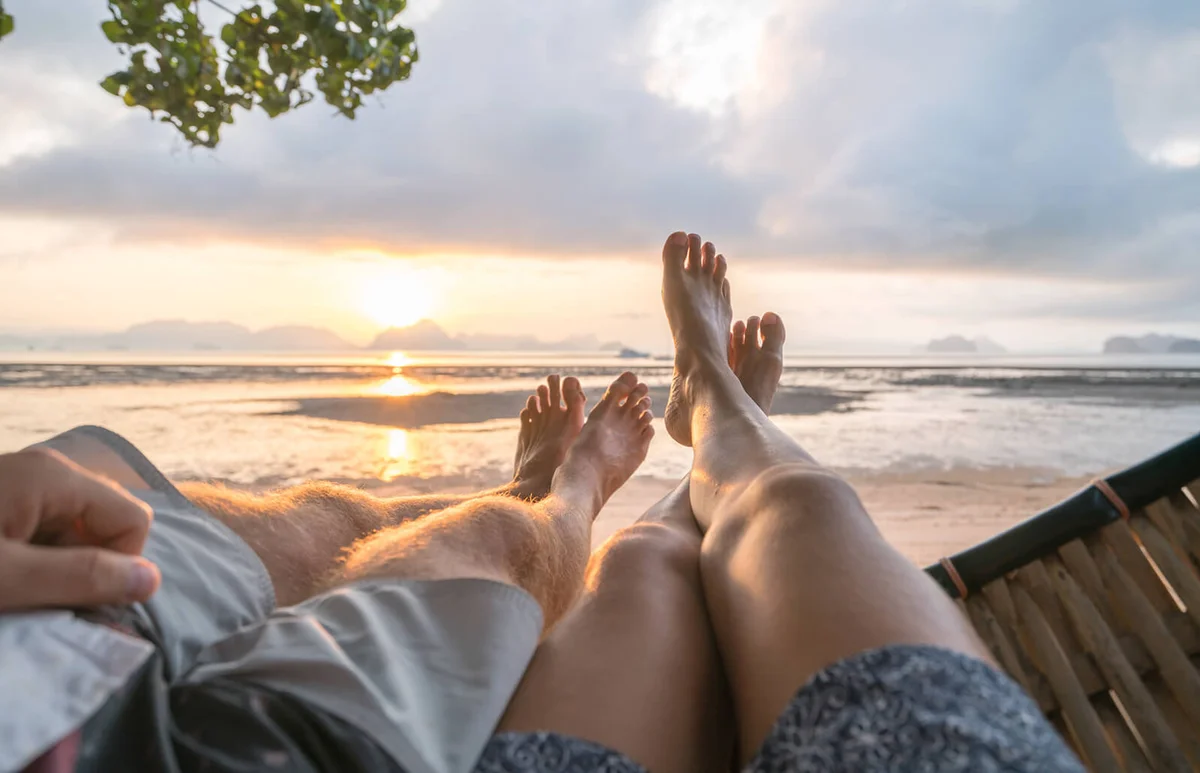 couple relaxing on hammock