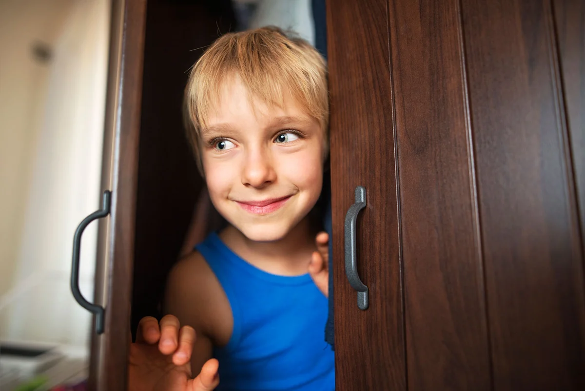 Boy playing pranks at camp