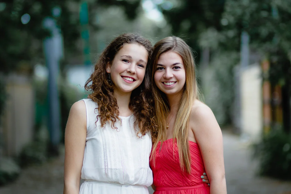 Two teenage girls in homecoming dresses