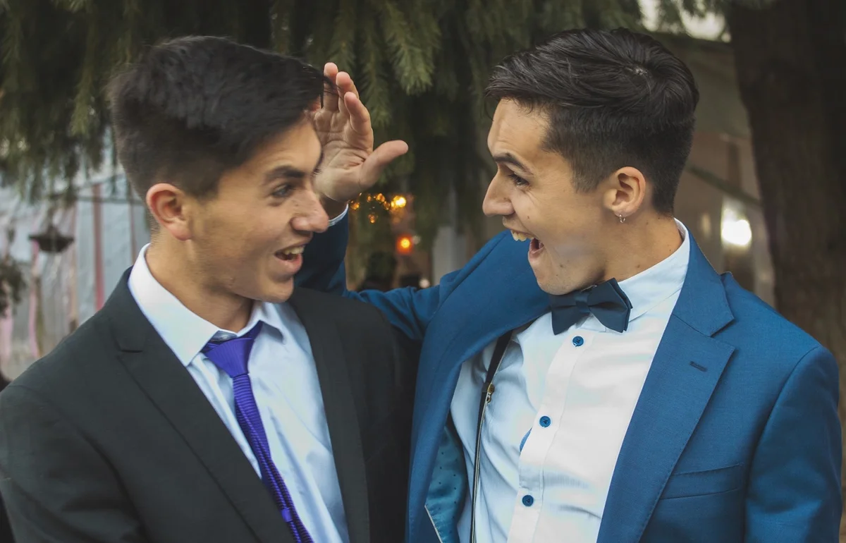 Guys in suits goofing around