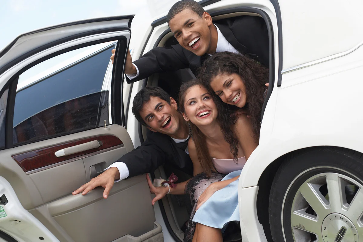 Two couples cramming limousine door