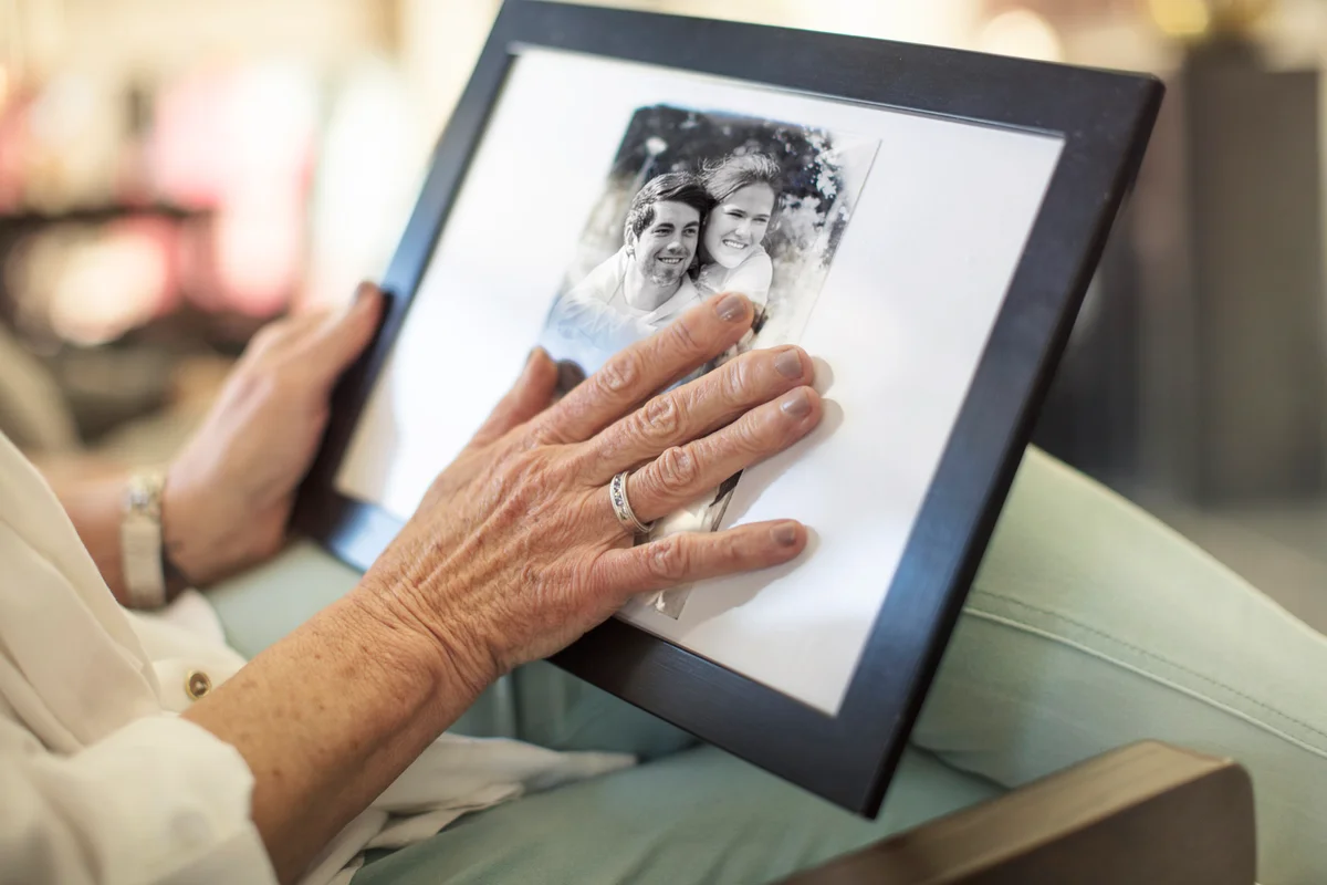 Senior woman holding a photograph