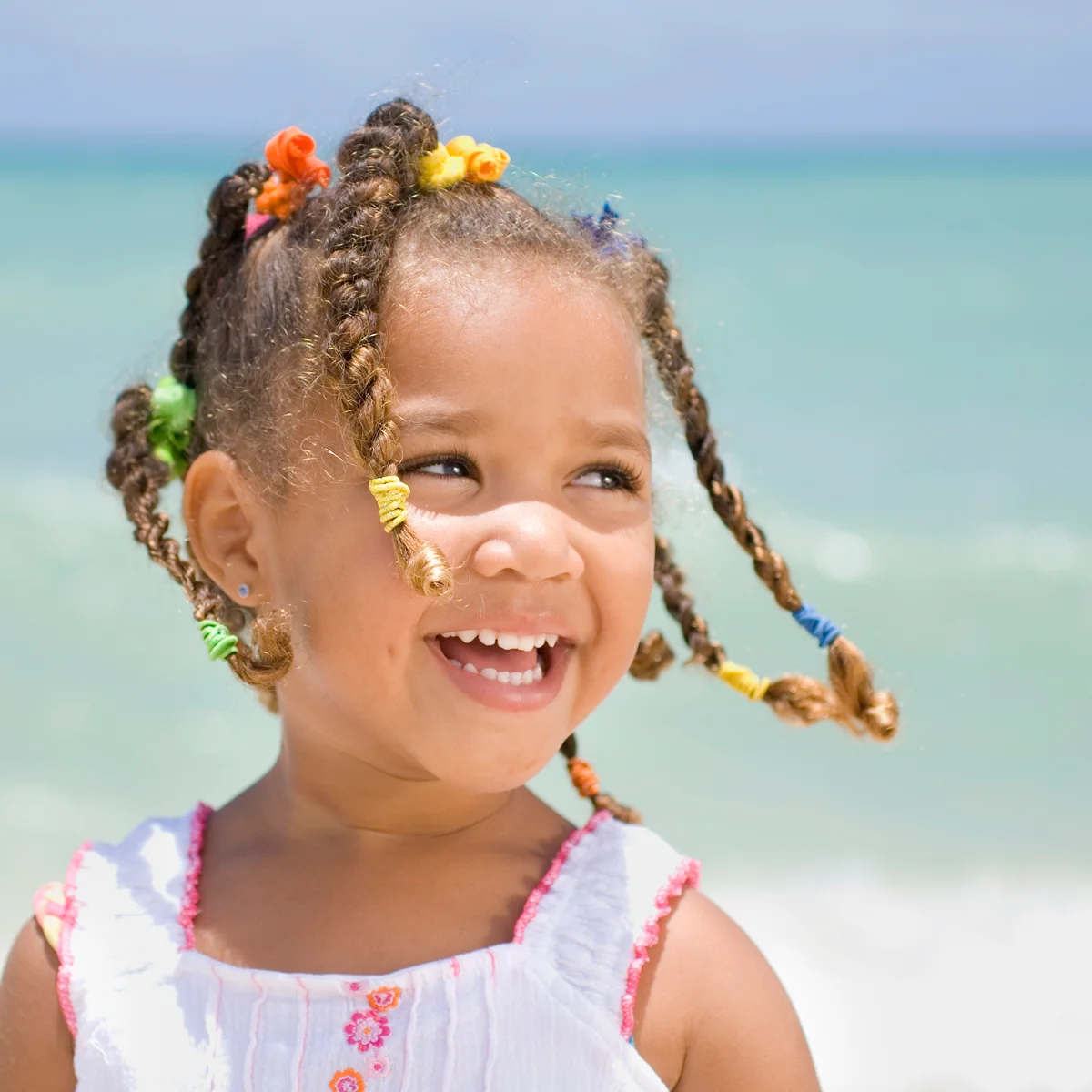 Young girl smiling at the beach