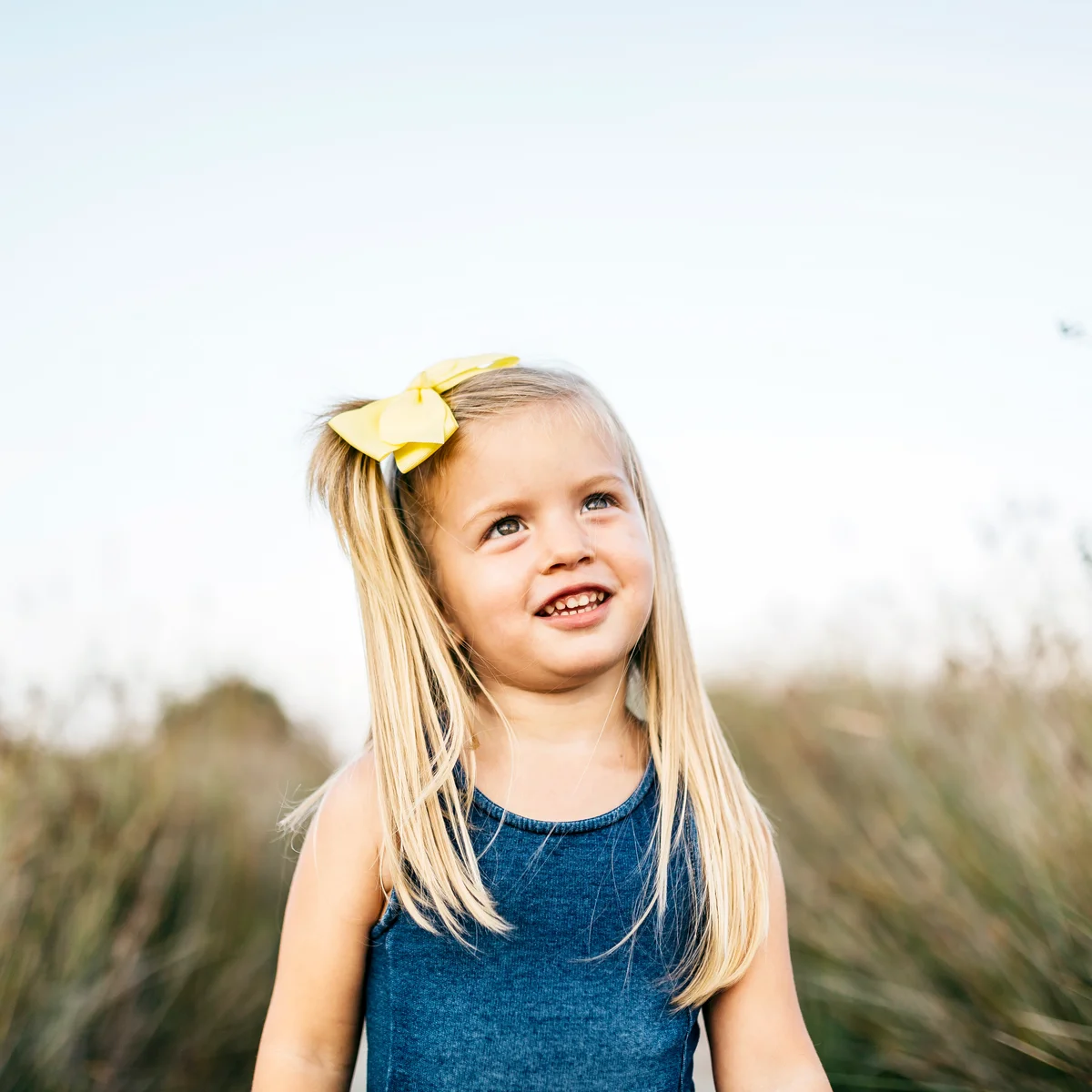 Portrait of smiling little girl with hair ribbon