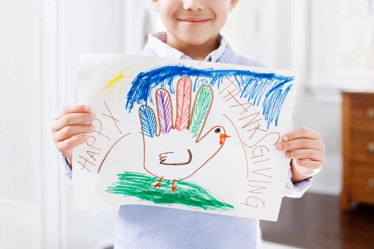 Boy with thanksgiving drawing