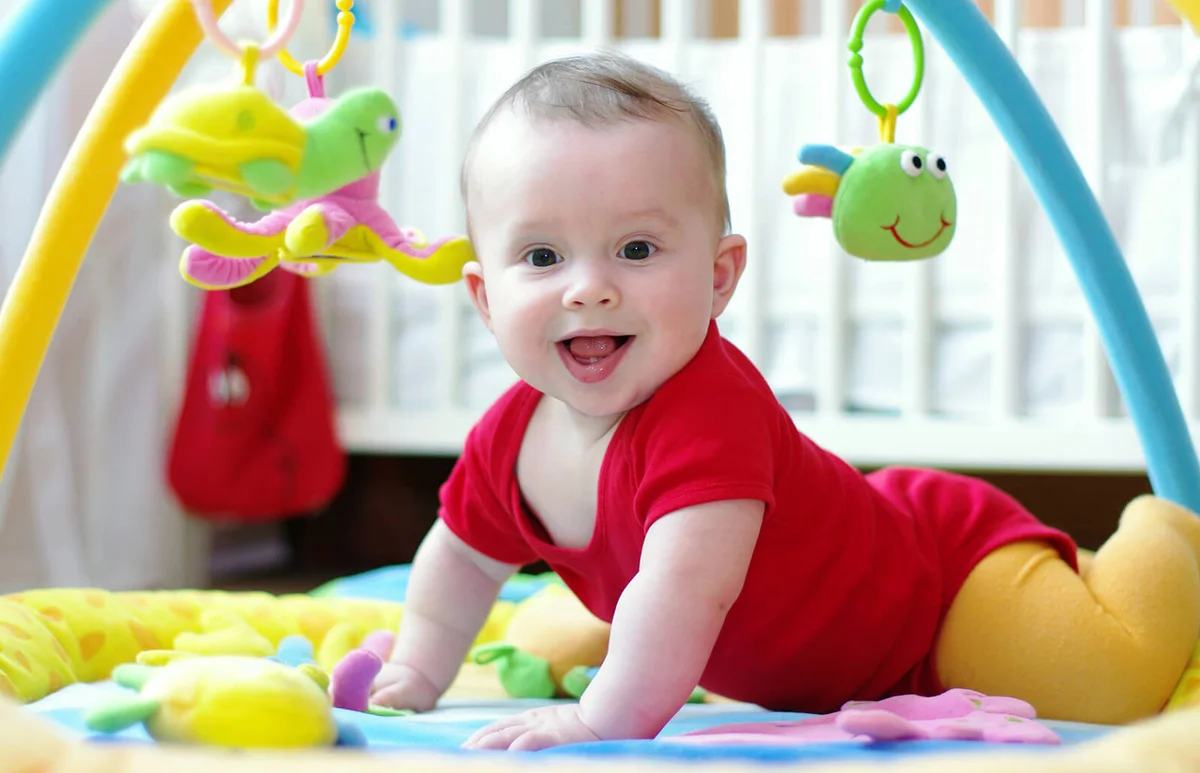 Baby age of 6 months on playmat