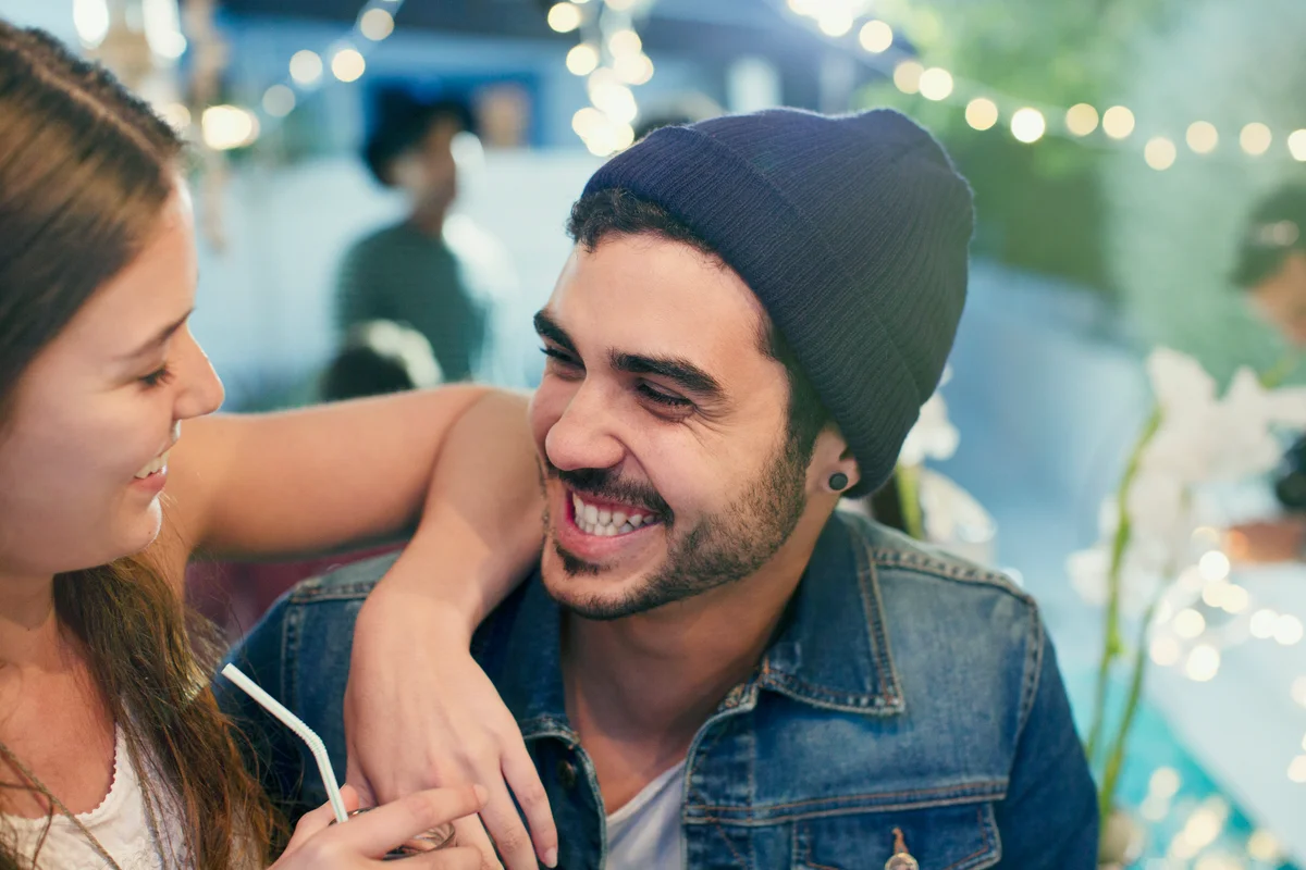 Couple laughing and relaxing at a party