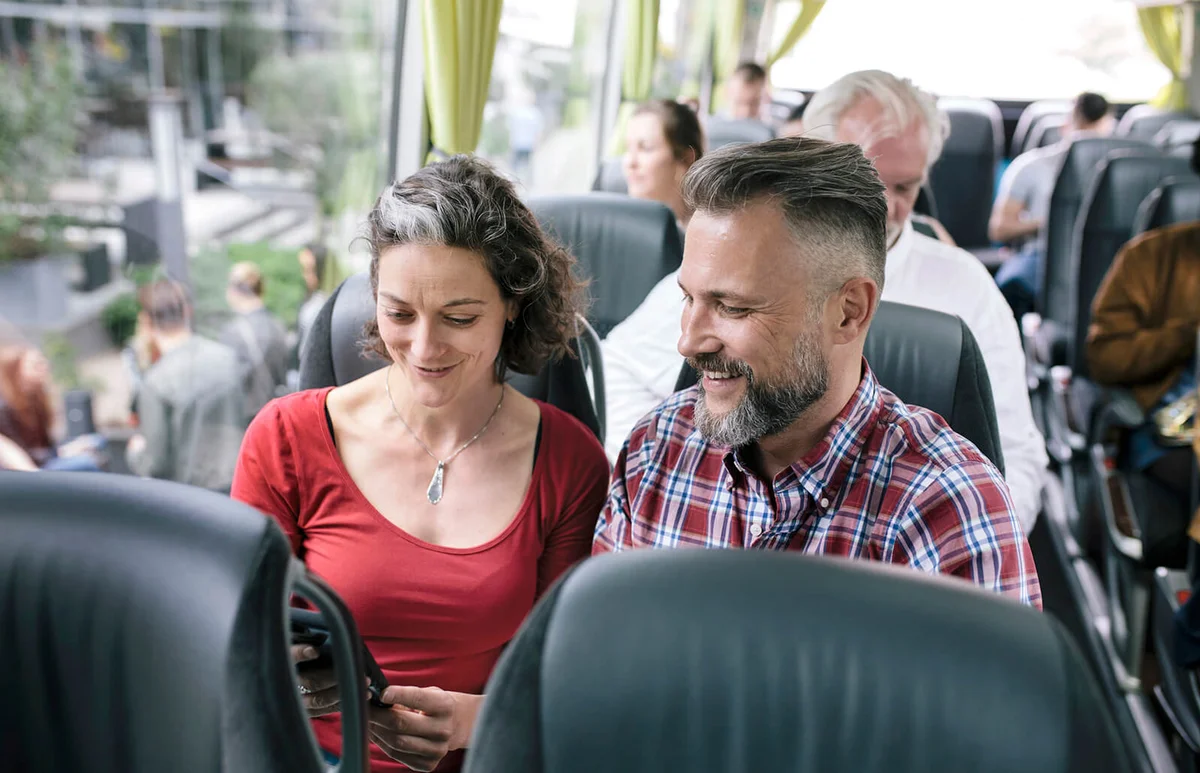 Couple Travelling On A Bus