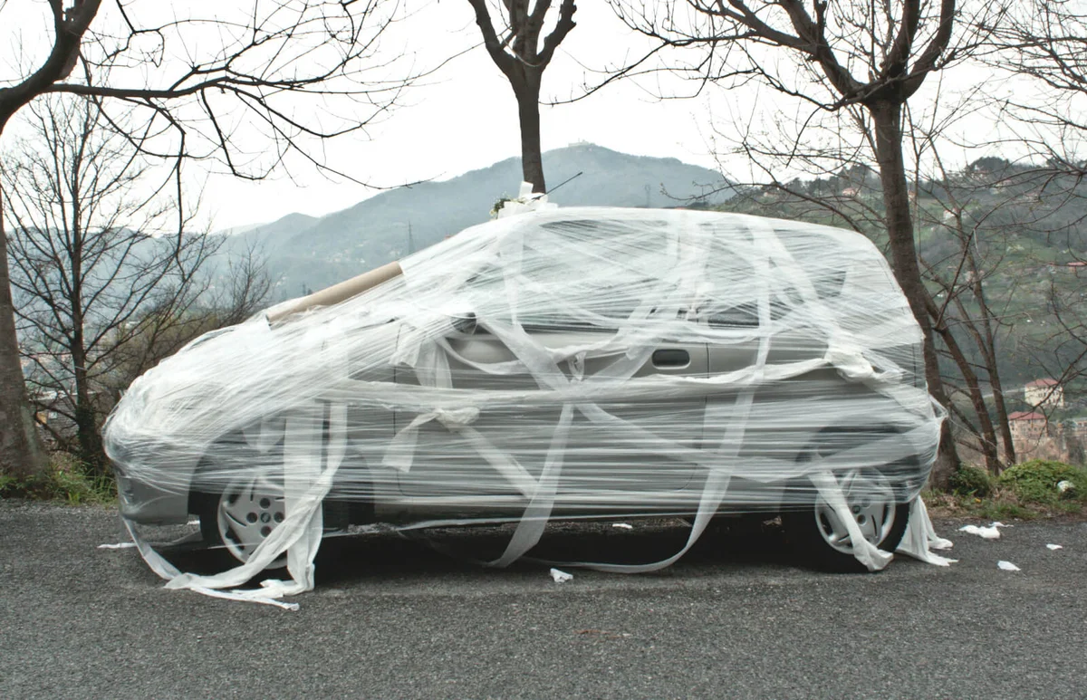 Car Wrapped In Plastic Parked On Road