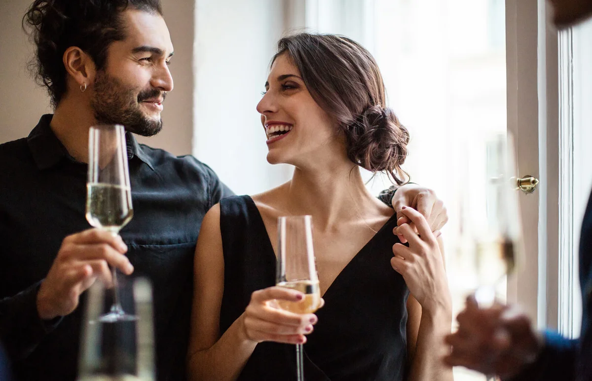 Couple holding champagne flutes