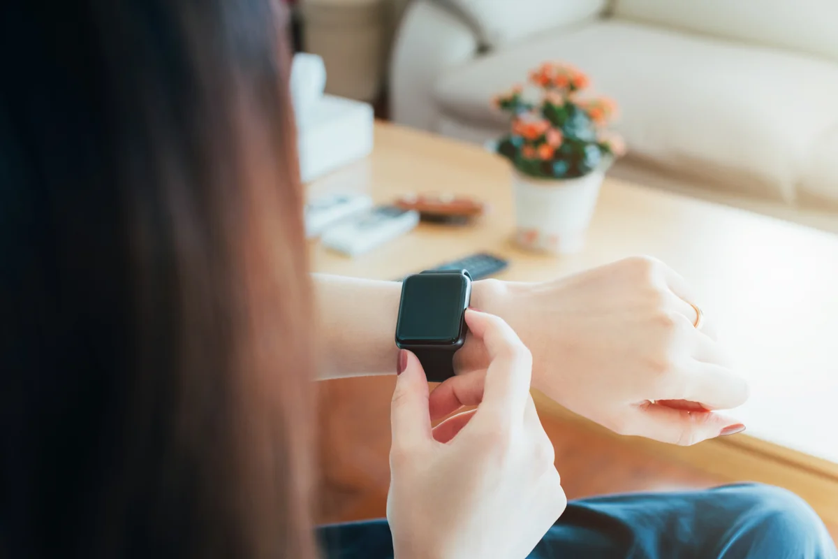 woman looking at her watch
