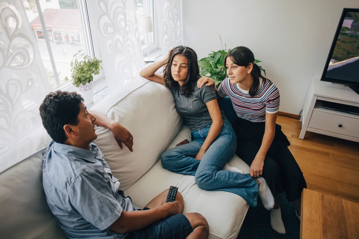 Family communicating on couch