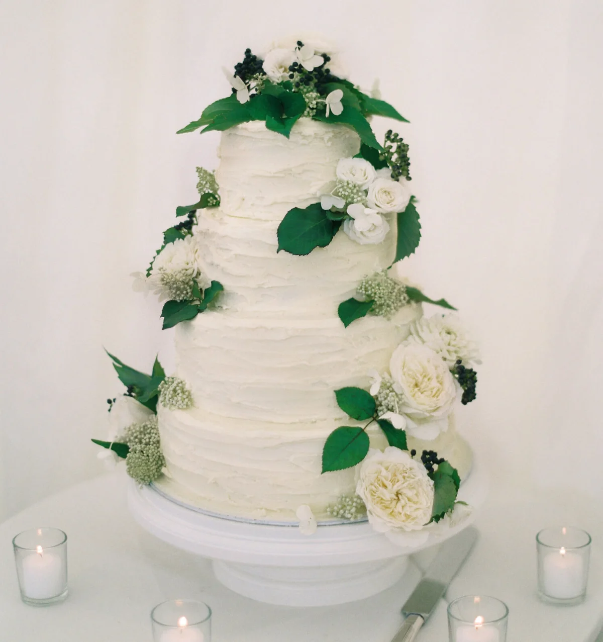 Frosted wedding cake with multiple tiers