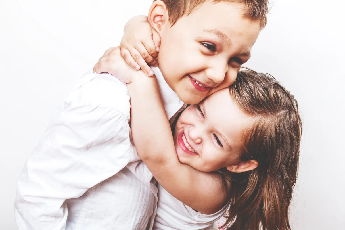 Girl hugging big brother