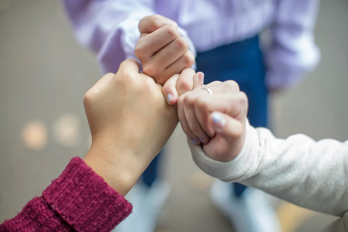 Teens hands pinky swear