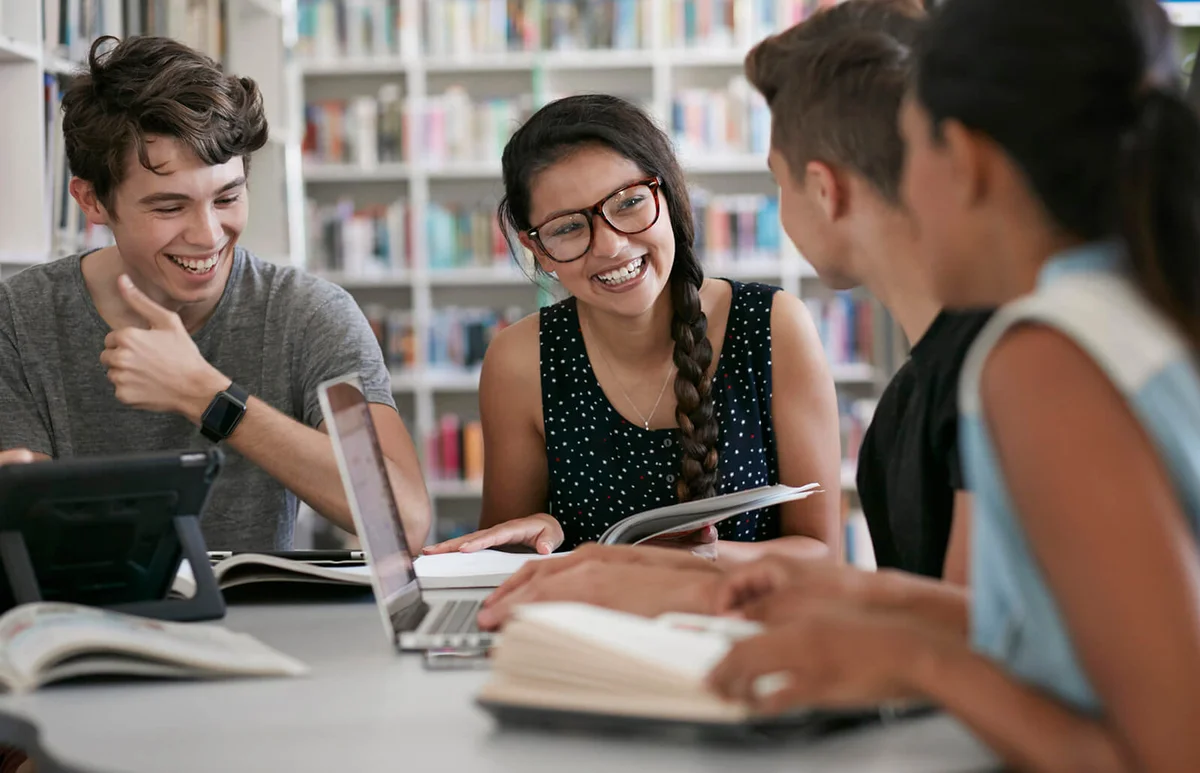 Group of students working in group & laughing