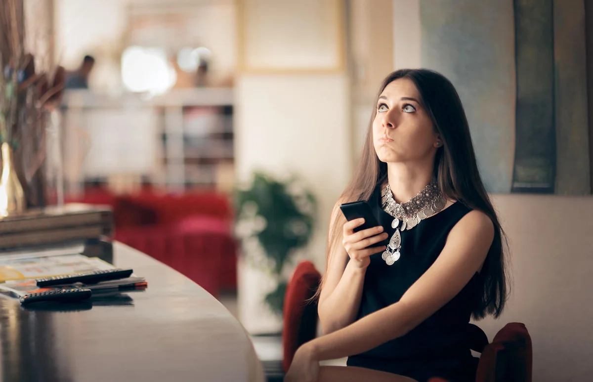 Woman Holding Smartphone Waiting for her Date
