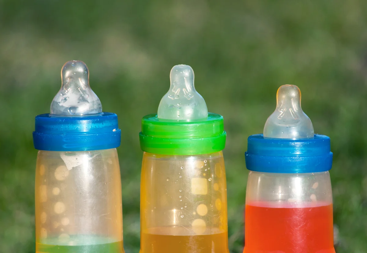 Baby bottles in the garden