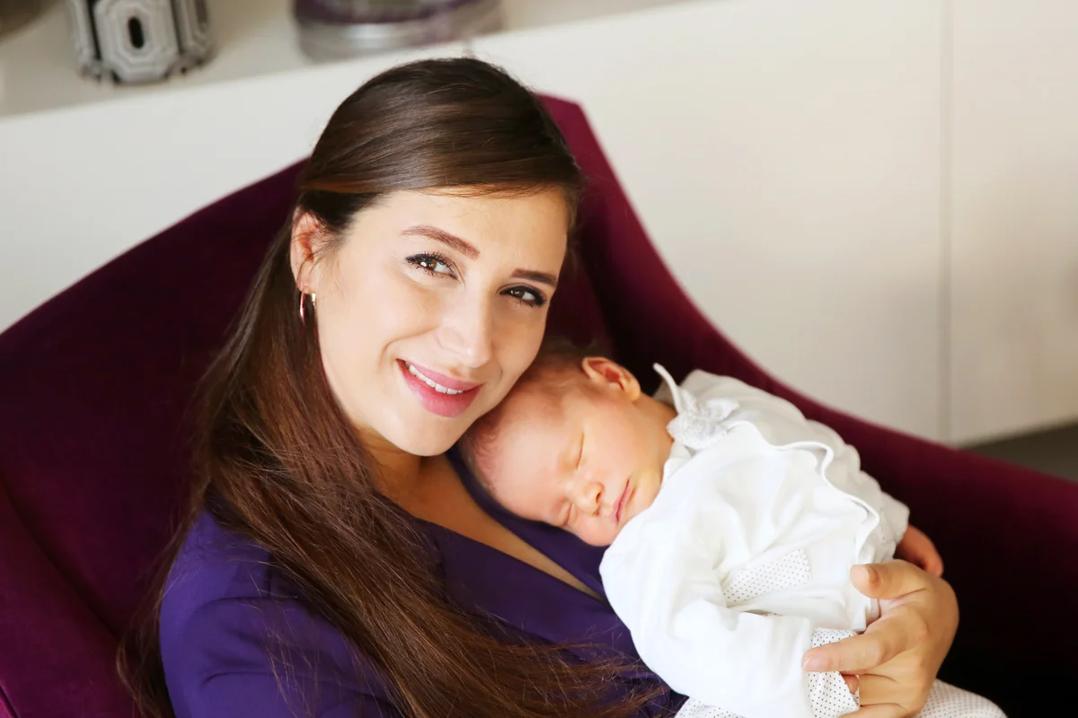 Mom and baby girl in a couch