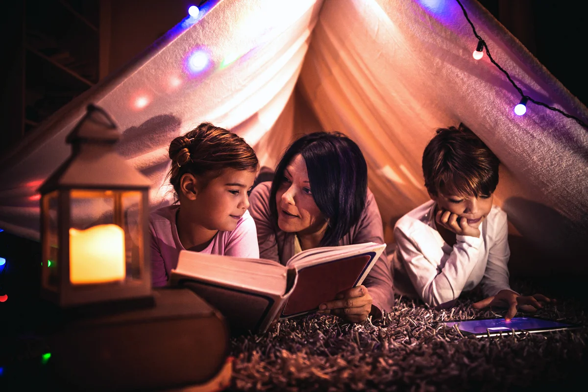 family camping out in living room