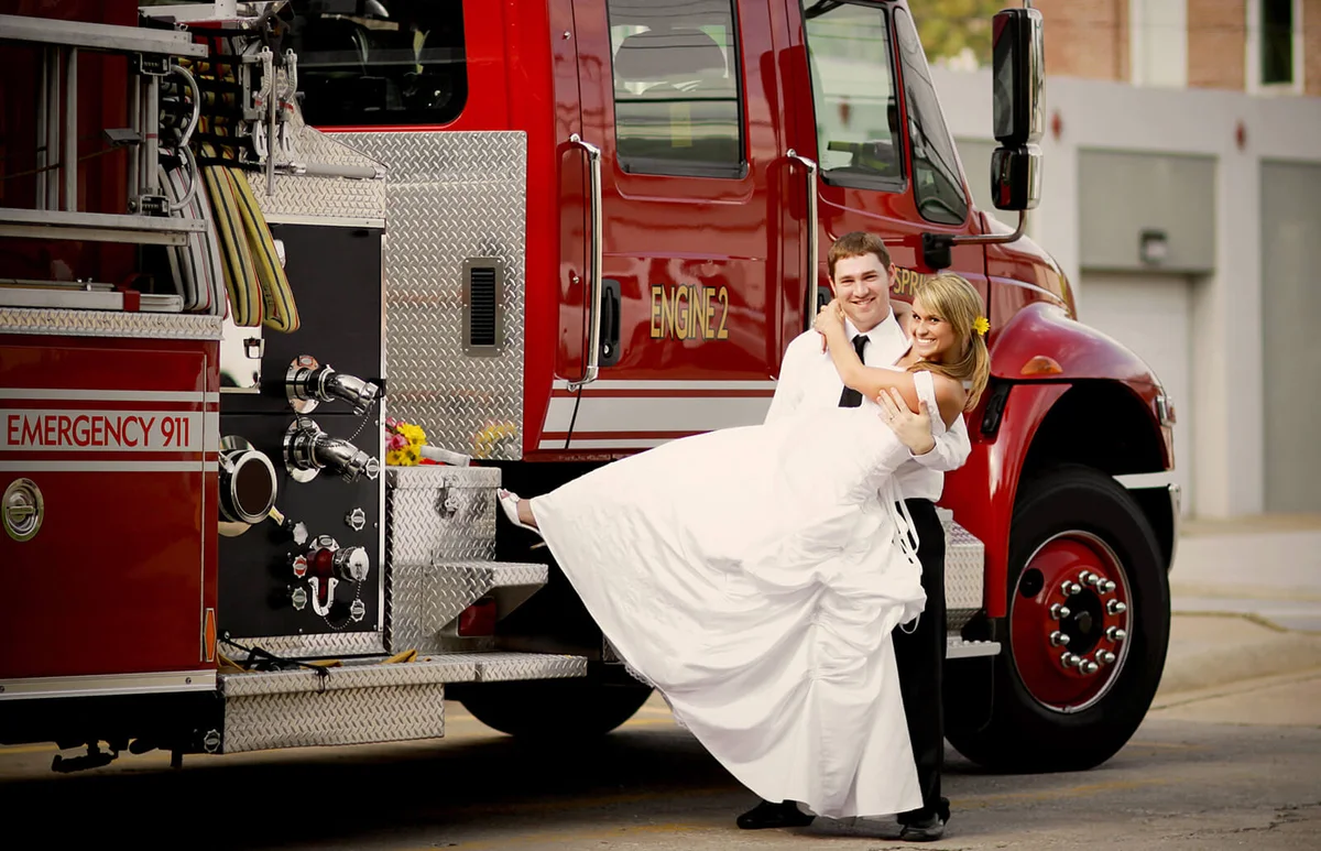 Couple in front of fire truck