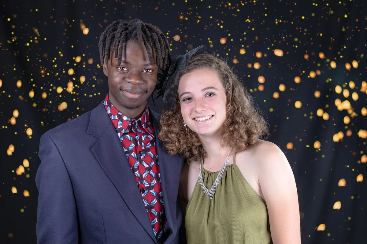 Couple in front of night sky backdrop