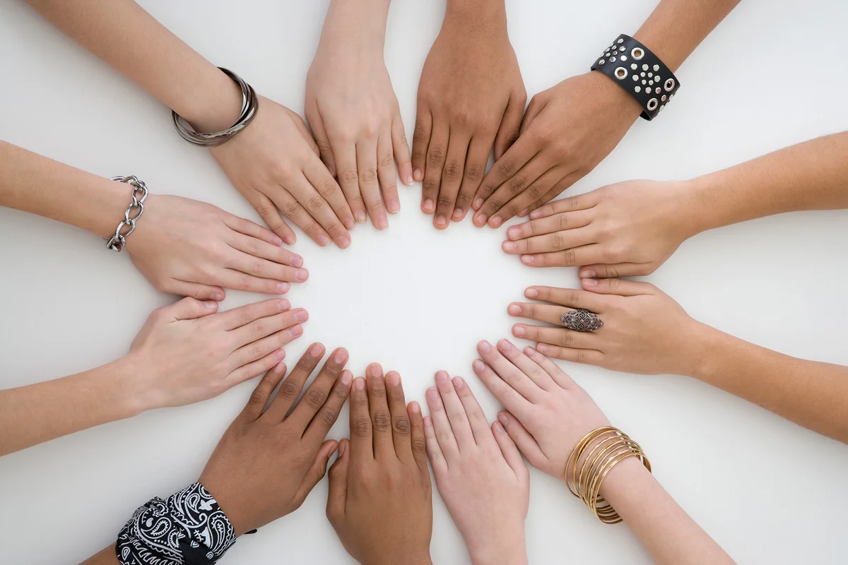 Diverse group of hands in circle