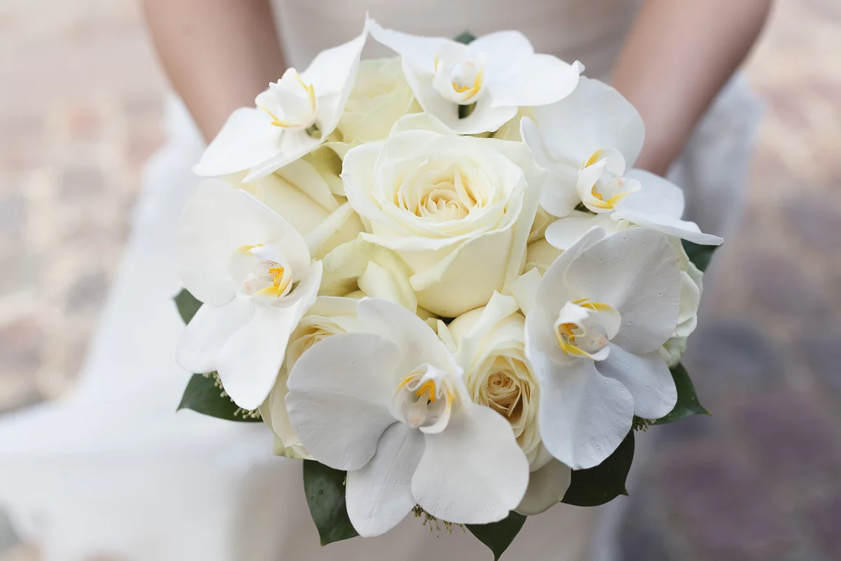 White roses and orchids wedding bouquet