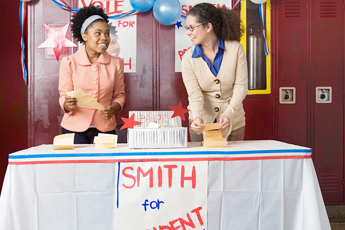 Girl and teacher counting votes