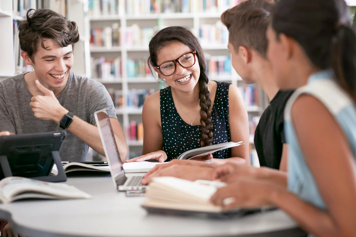 Group of students working in group & laughing