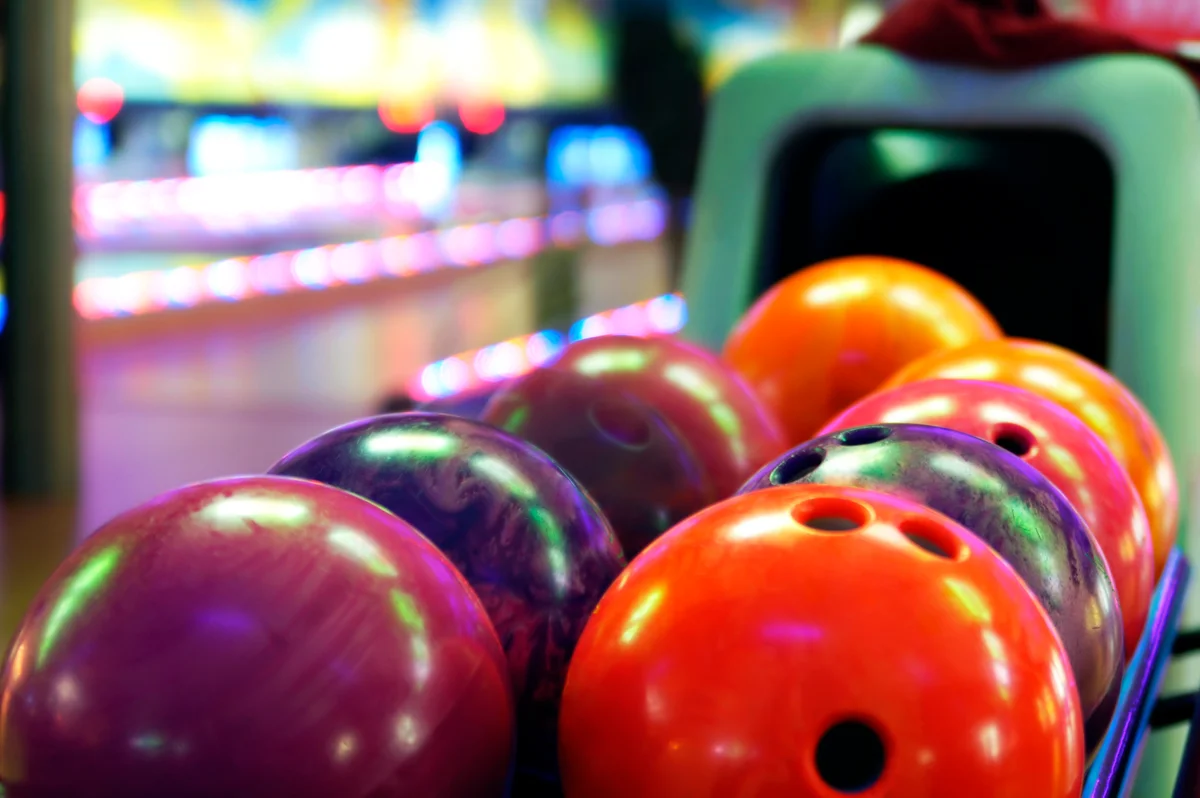 Bowling balls at bowling alley lined up