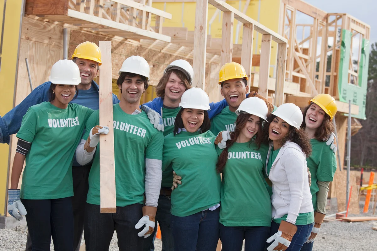 High school volunteers working on construction site