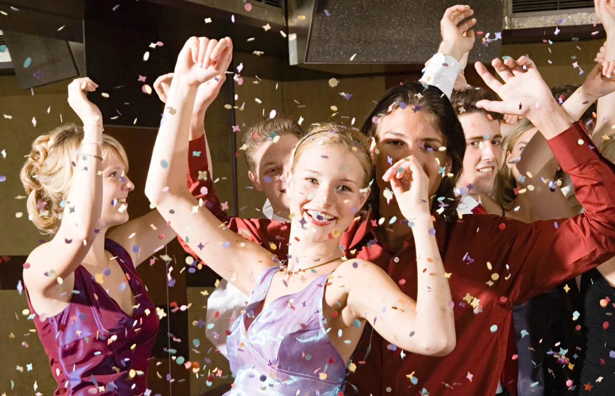 Teenagers dancing at homecoming