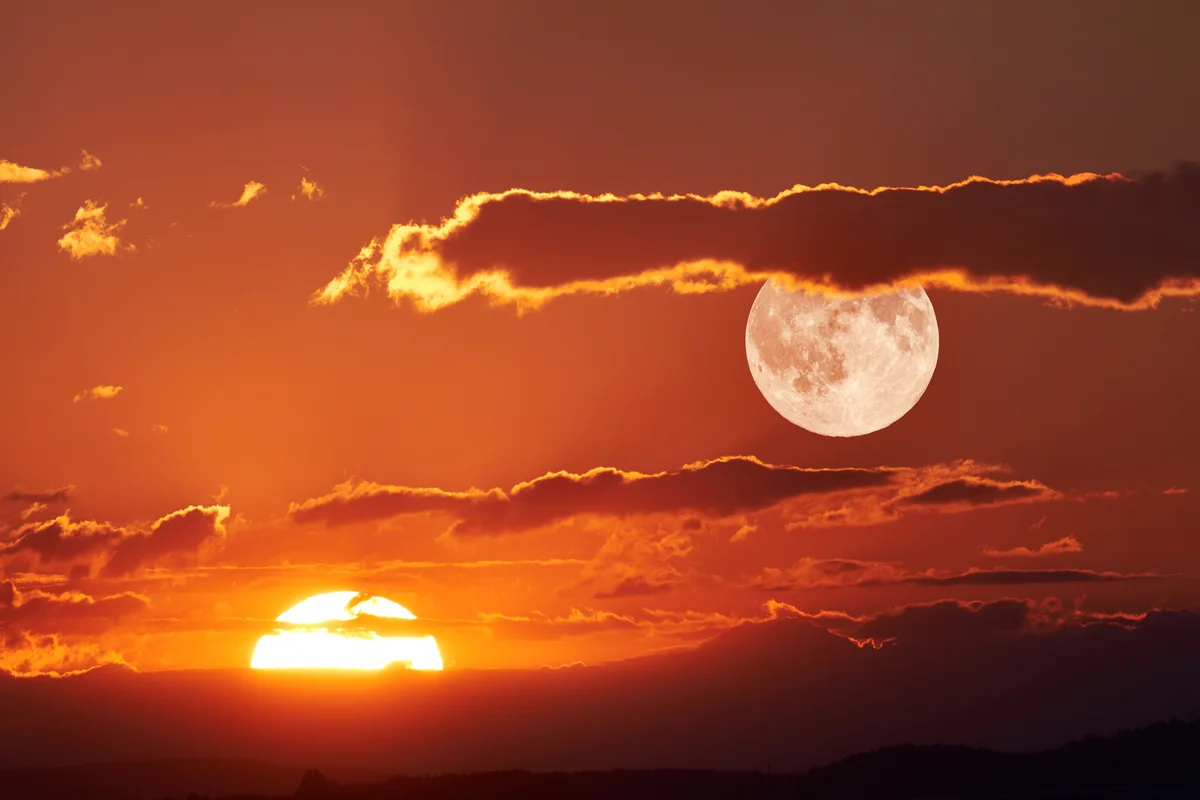 Scenic View Of Full Moon During Sunset
