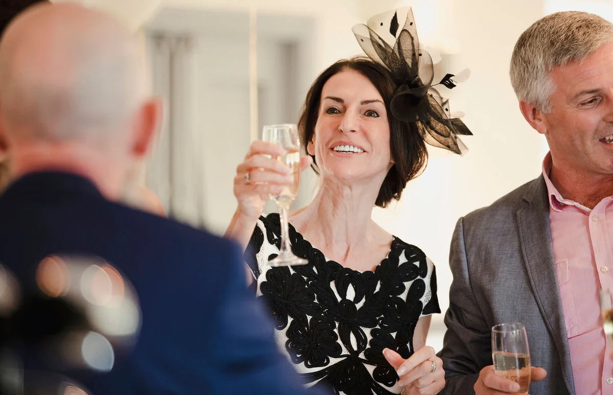 Bride's parents are toasting to their daughter and son-in-law