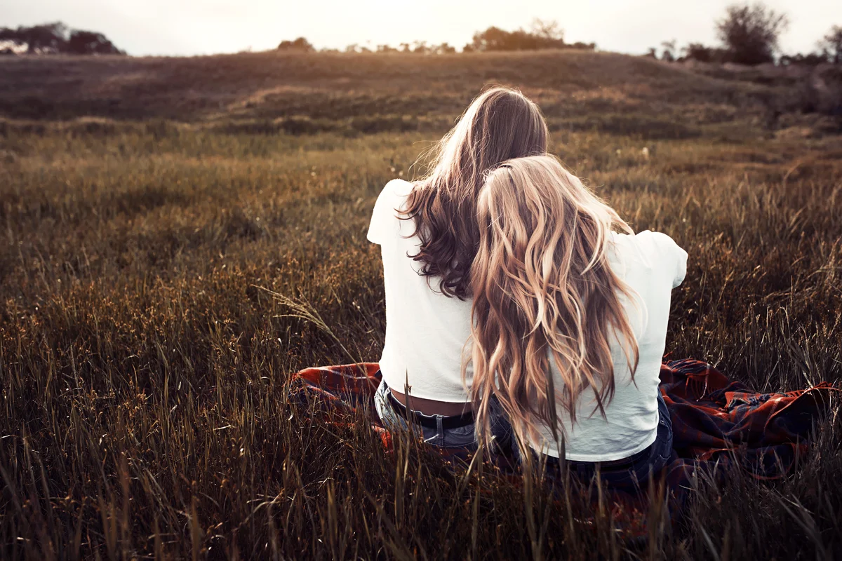 Couple in white t-shirts in rural field