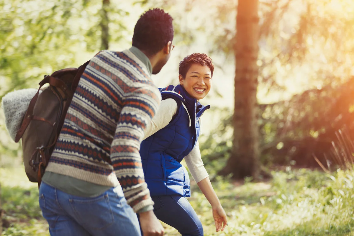 Couple hiking with day pack