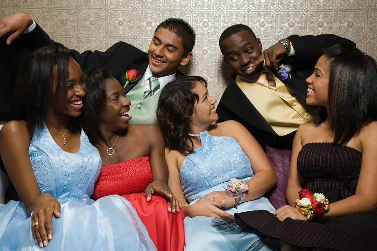 Teens in formal wear enjoying themselves