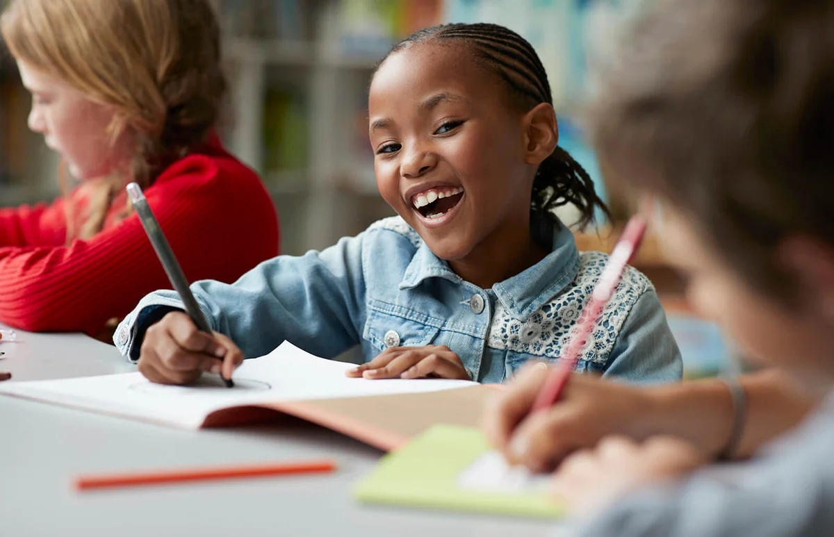 schoolgirl drawing at the school library