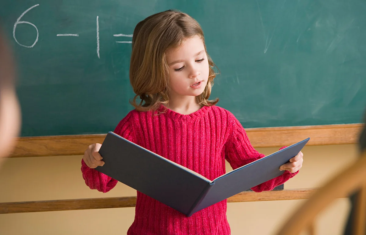 Girl having presentation in classroom