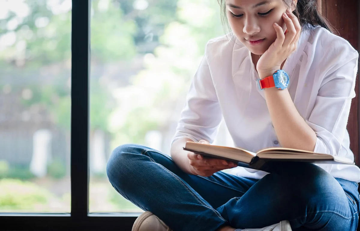 Teenage Girl Reading Book