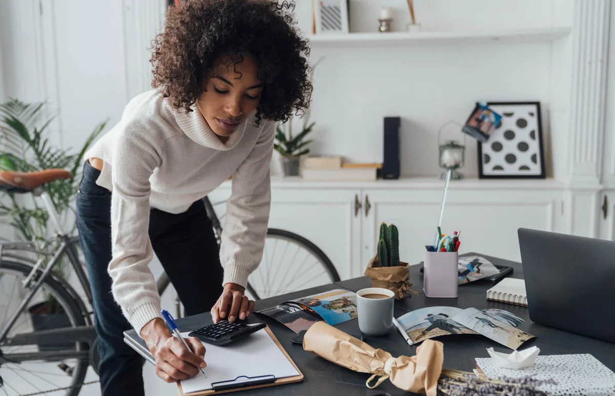 Freelancer standing at hert desk