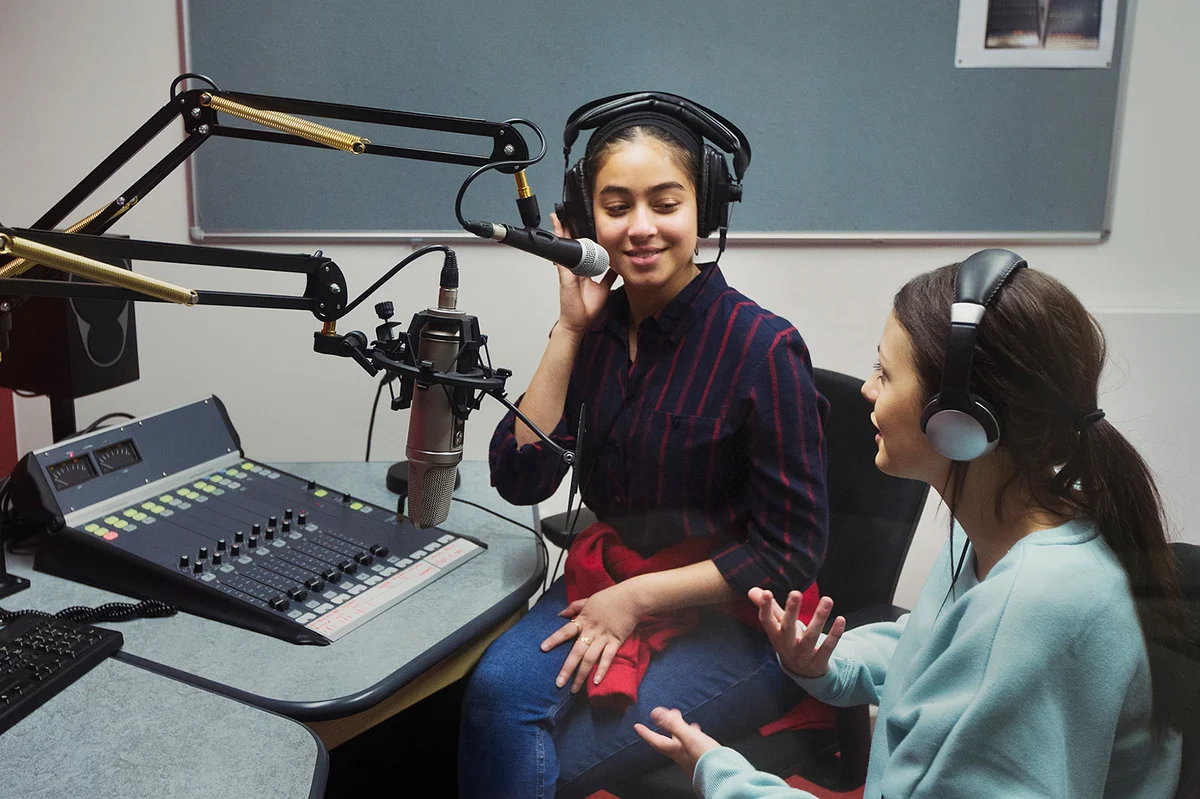 Teen girls recording podcast