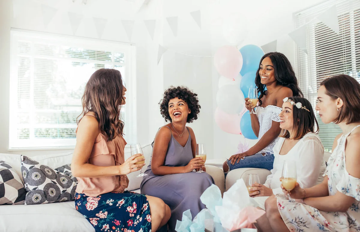 Female friends having fun at baby shower