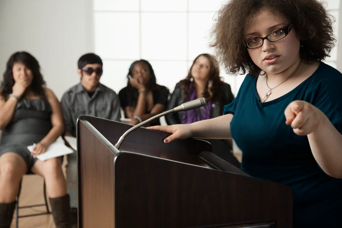 Girl giving speech in debate class