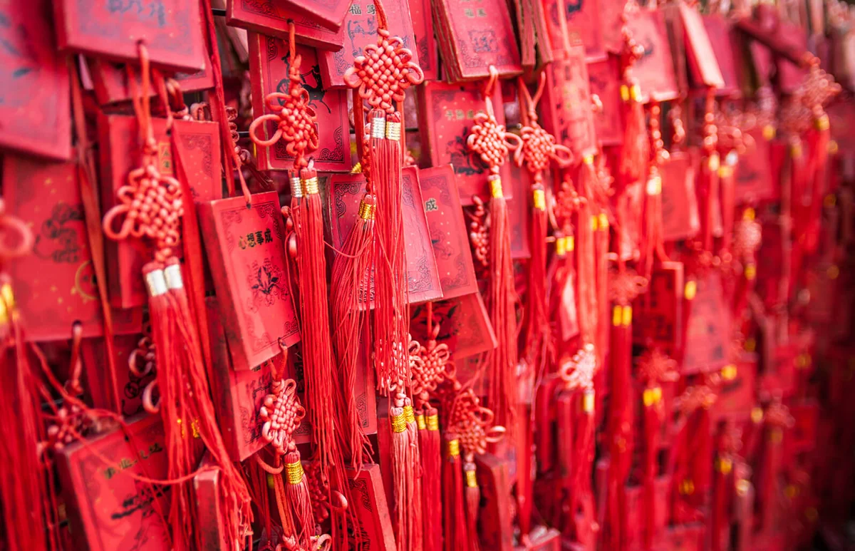 Hanging red wooden prayer blocks