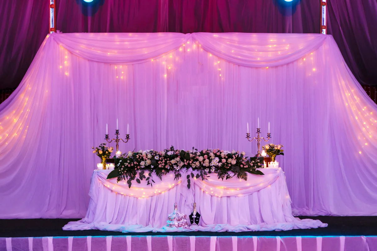Wedding table in the restaurant with flower composition