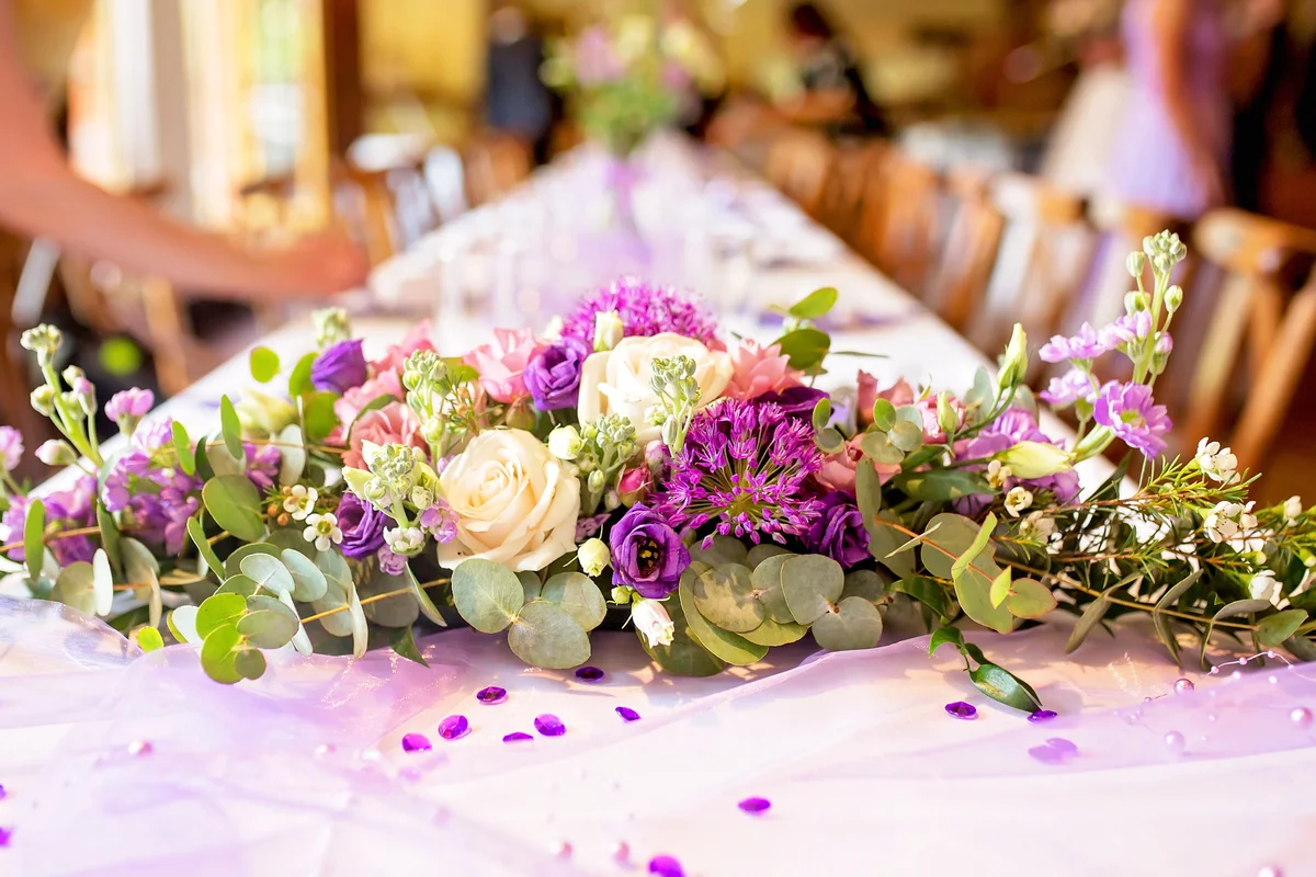 Elegant table setup in purple pastels for a restaurant wedding